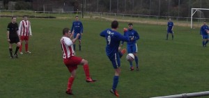 Larkhall Thistle's JP Grant in a challenge against Dunipace