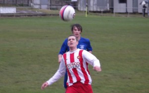 Larkhall Thistle's new signing Brian Jack challenges for the ball